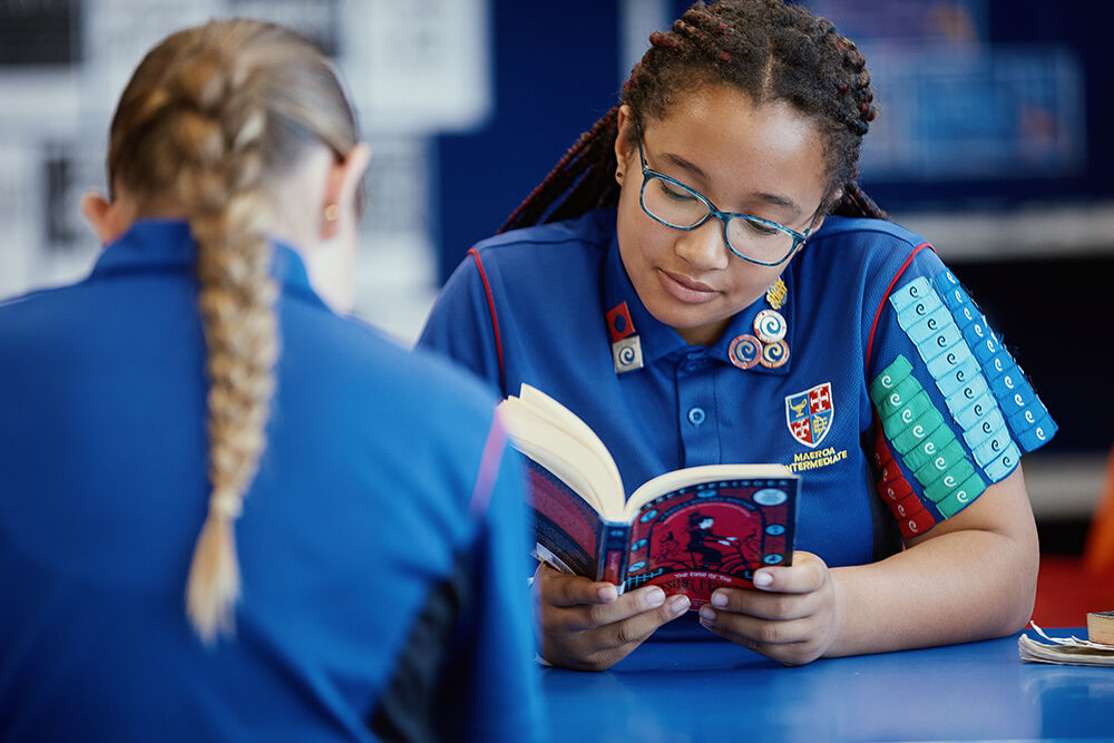 Student reading a novel during an English lesson at Maeroa Intermediate.