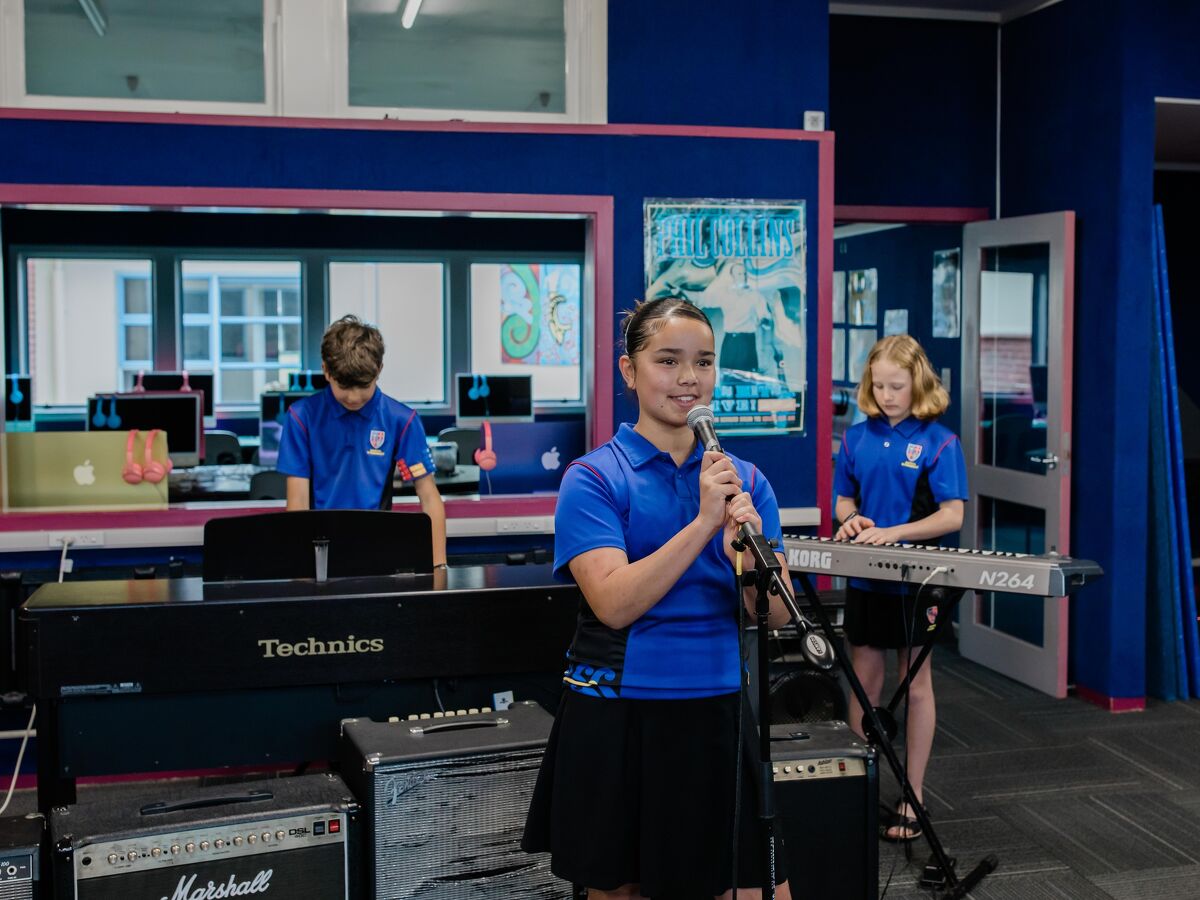 Students at Maeroa Intermediate playing musical instruments in a classroom