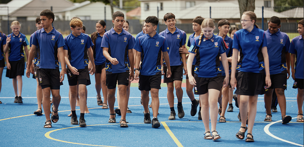 Group of Maeroa Intermediate students walking together on the school’s outdoor court.